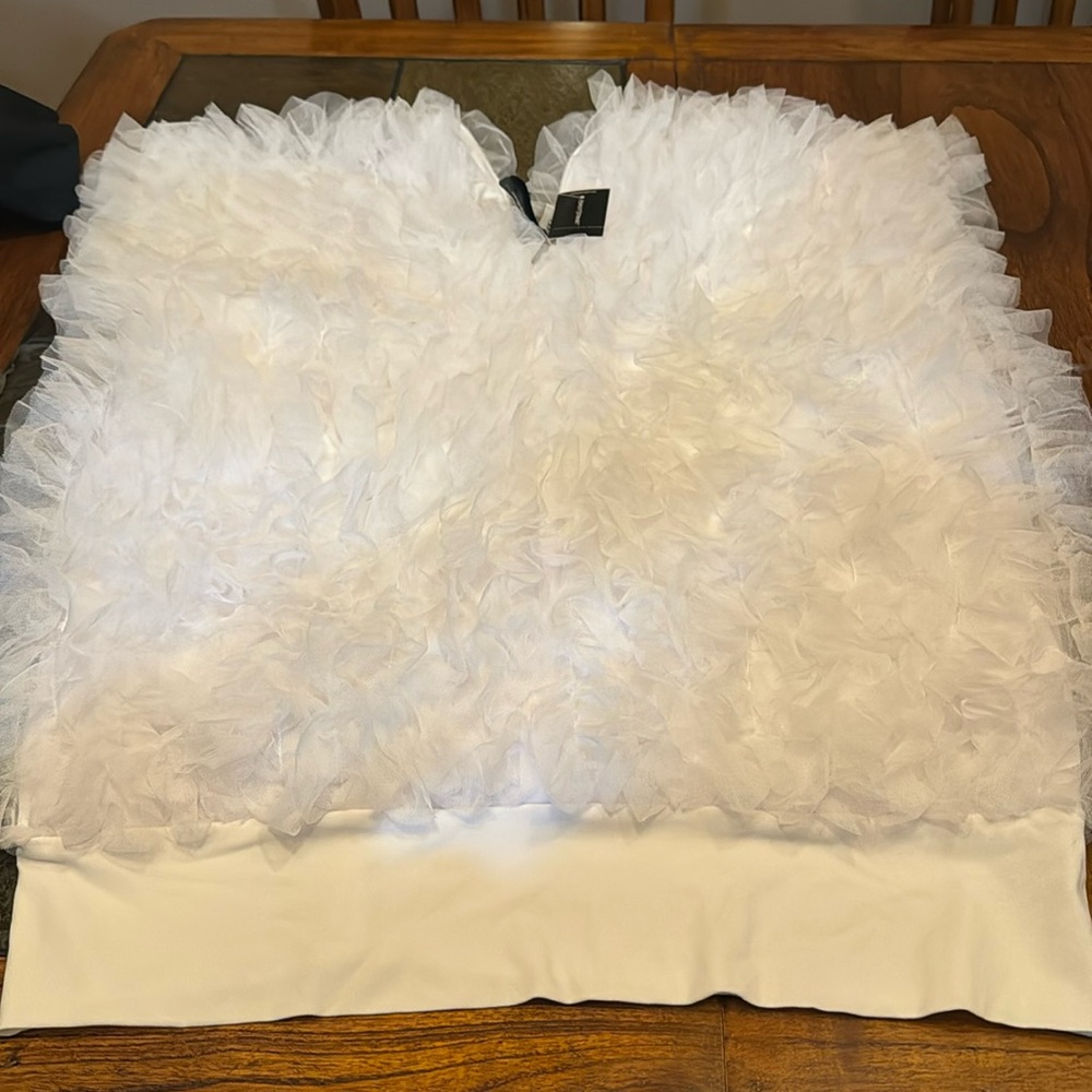 White tule/ netting top with a band at bottom. Size 18/20